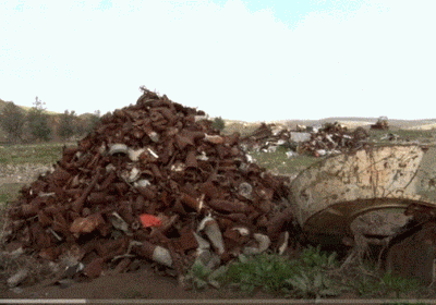 رويترز: المليشيات الإيرانية تسيطر على سوق الخردة بالموصل 