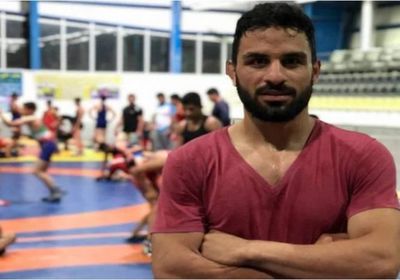  أول تعليق من والدة المصارع الإيراني الذي تم إعدامه