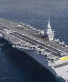 ماكرون يعلن موافقته على بناء حاملة طائرات جديدة